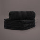 Face towels from the Black Silly-Cuddly, a set of 8 black & gold towels you can buy online at Sukham Home, a sustainable furniture, kitchen & dining and home decor store in Kolkata, India