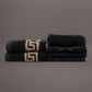Embroidered hand and face towels from the Black Silly-Cuddly, a set of 8 black & gold towels you can buy online at Sukham Home, a sustainable furniture, kitchen & dining and home decor store in Kolkata, India