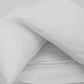 Both pillowcases and bedsheet of the White Classic Solid Bedsheet, a king size and queen size cotton bedsheet you can buy online at Sukham Home, a sustainable furniture, gardening and home decor store in Kolkata, India