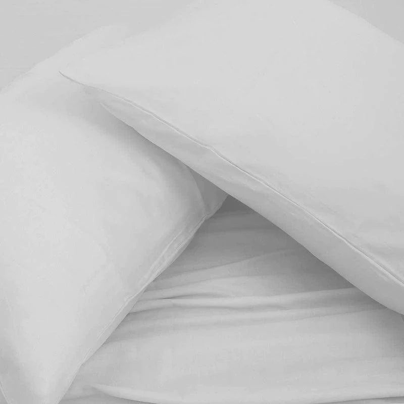 Both pillowcases and bedsheet of the White Classic Solid Bedsheet, a king size and queen size cotton bedsheet you can buy online at Sukham Home, a sustainable furniture, gardening and home decor store in Kolkata, India