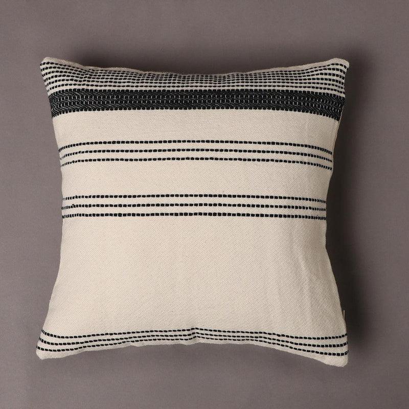 Against a grey background, the Linear Beige Cushion, a linen black and white geometric printed accent pillow you can buy online at Sukham Home, a sustainable furniture, kitchen & dining and home decor store in Kolkata, India